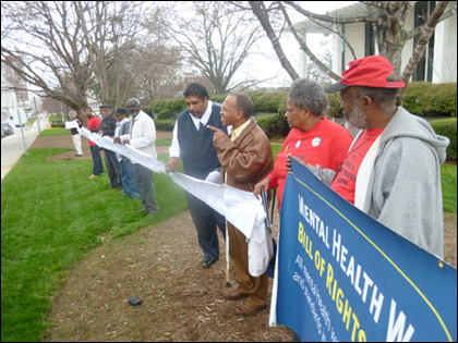 Mental health workers and supporters demonstrate in front of the N.C. General Assembly building in Raleigh. Over 2,000 post cards have been collected by workers and community supporters calling for passage of the Mental Health Workers Bill of Rights. 